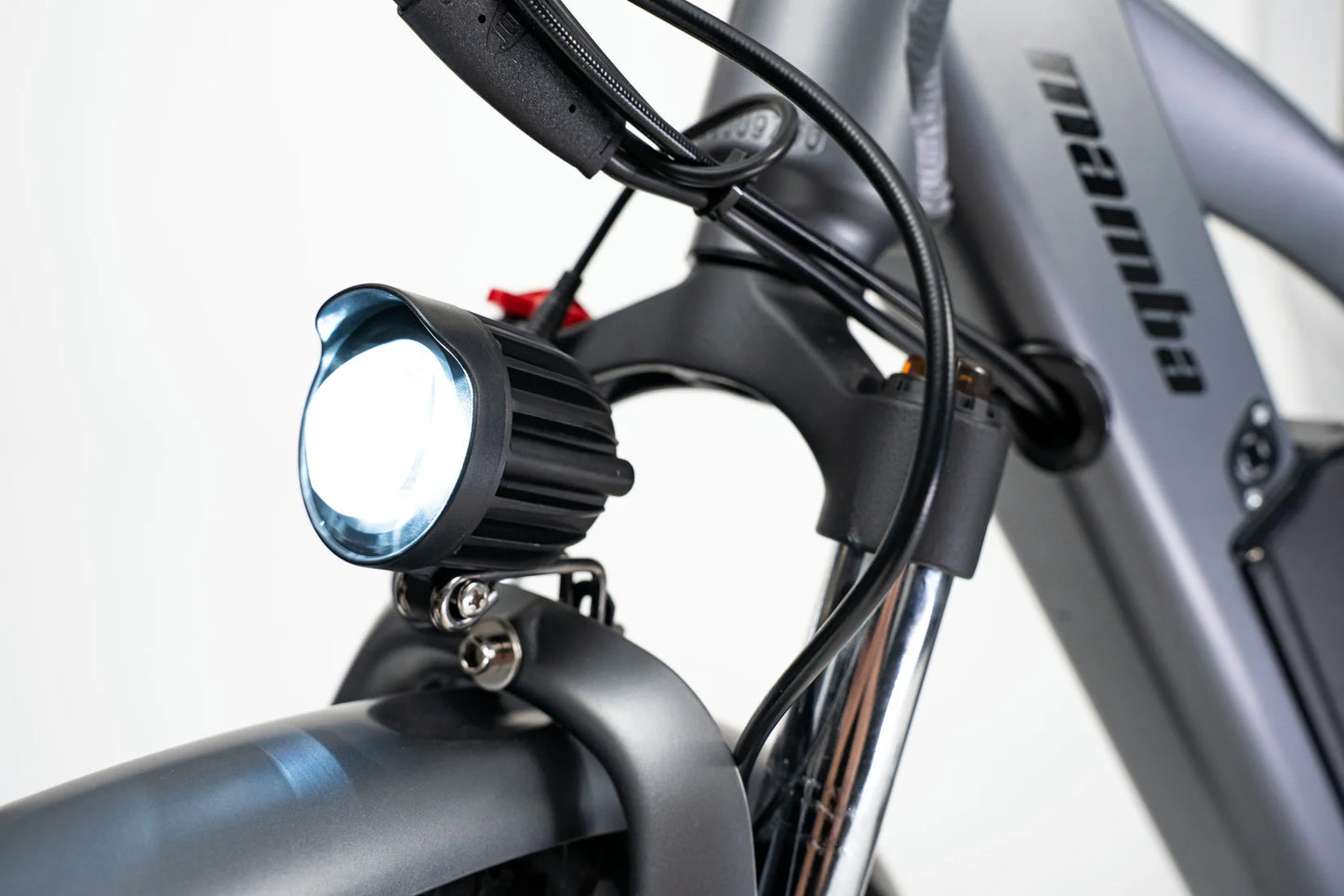 Close-up of the bright LED headlight on the Mamba Venom 2024 e-bike, perfect for safe night riding, available at SalteBikes