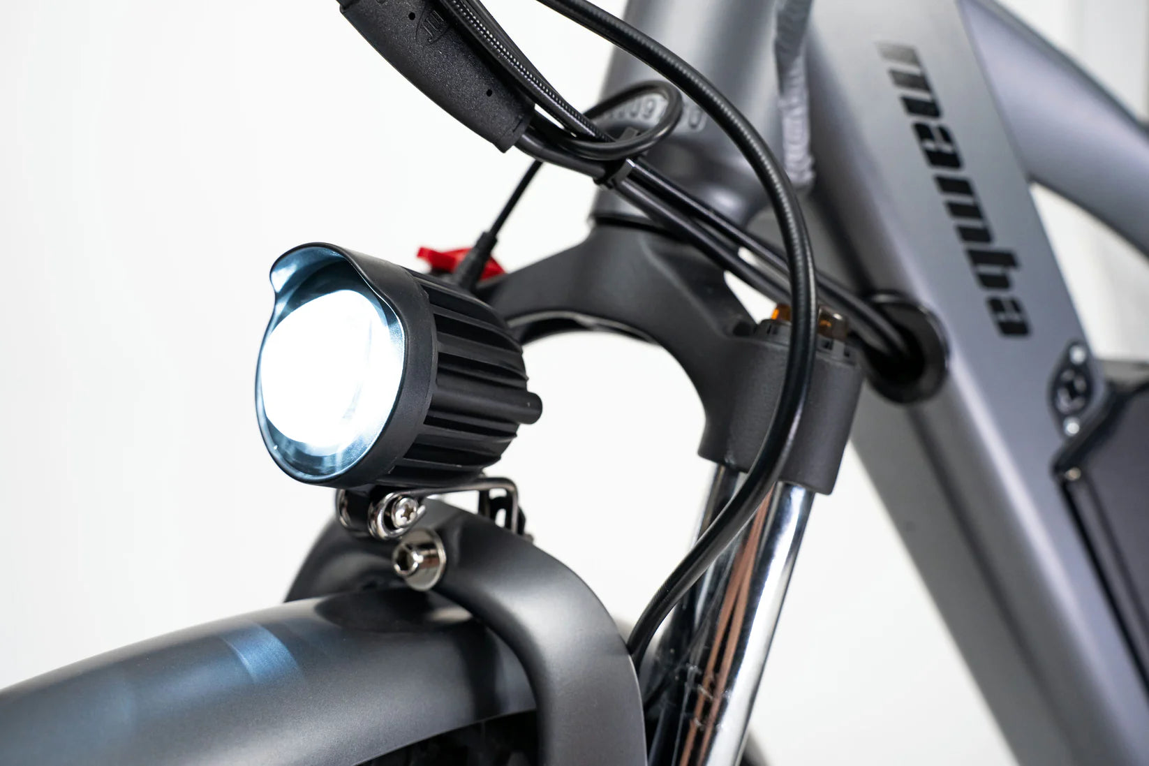Close-up of the bright LED headlight on the Mamba Venom 2024 e-bike, perfect for safe night riding, available at SalteBikes
